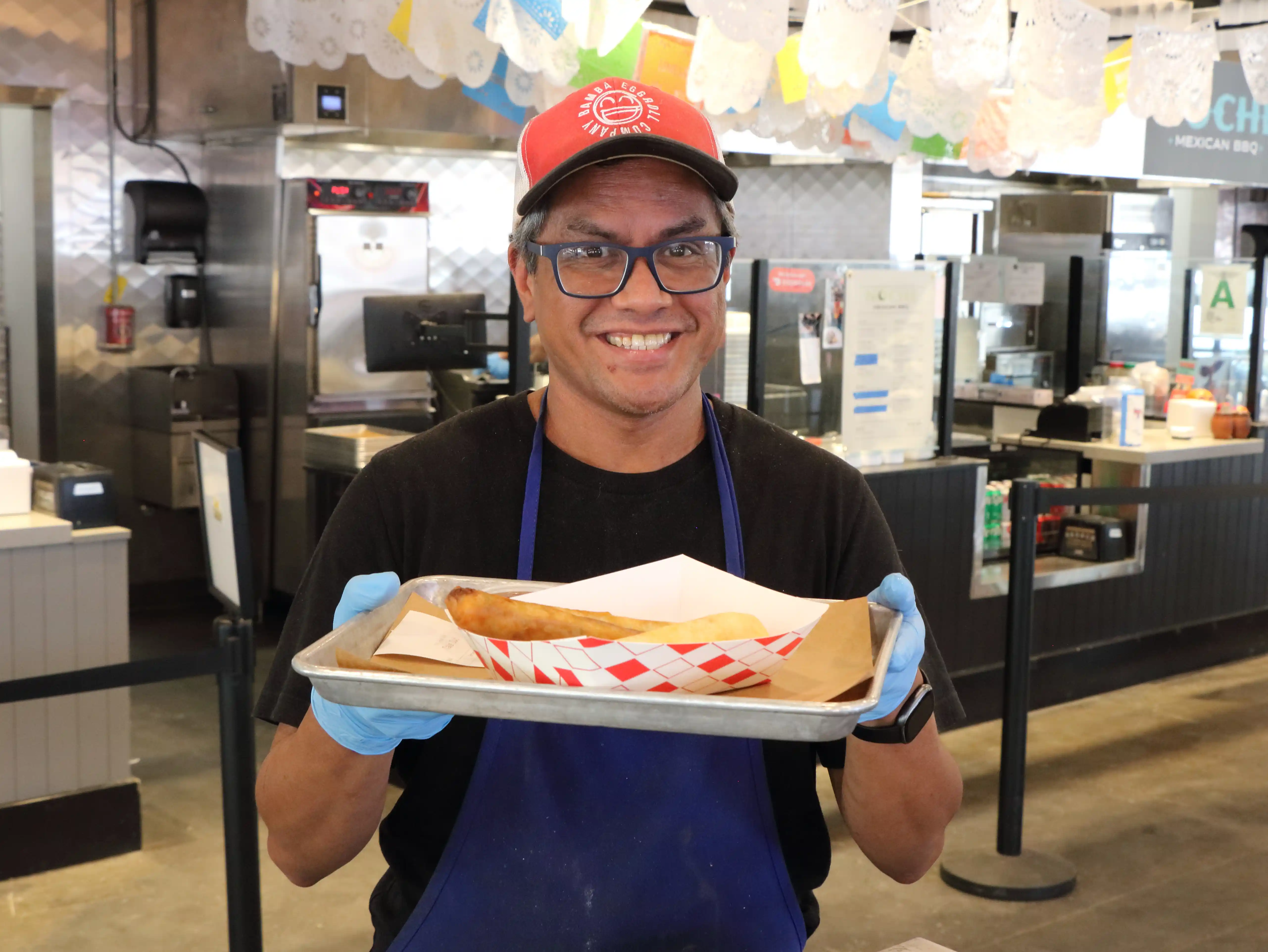 rudy bamba holding egg rolls